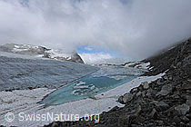 F076816: Wolkenstimmung über Gletschersee